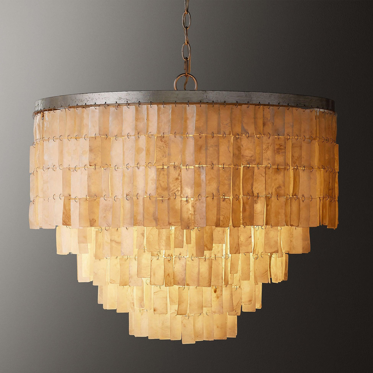 Chandelier with tiered design on a gray background