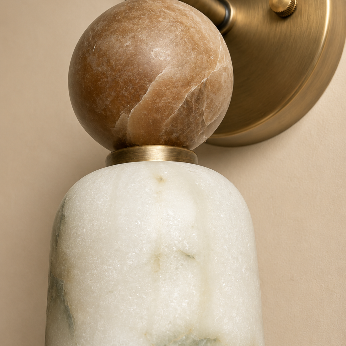Marble wall sconce with a beige background