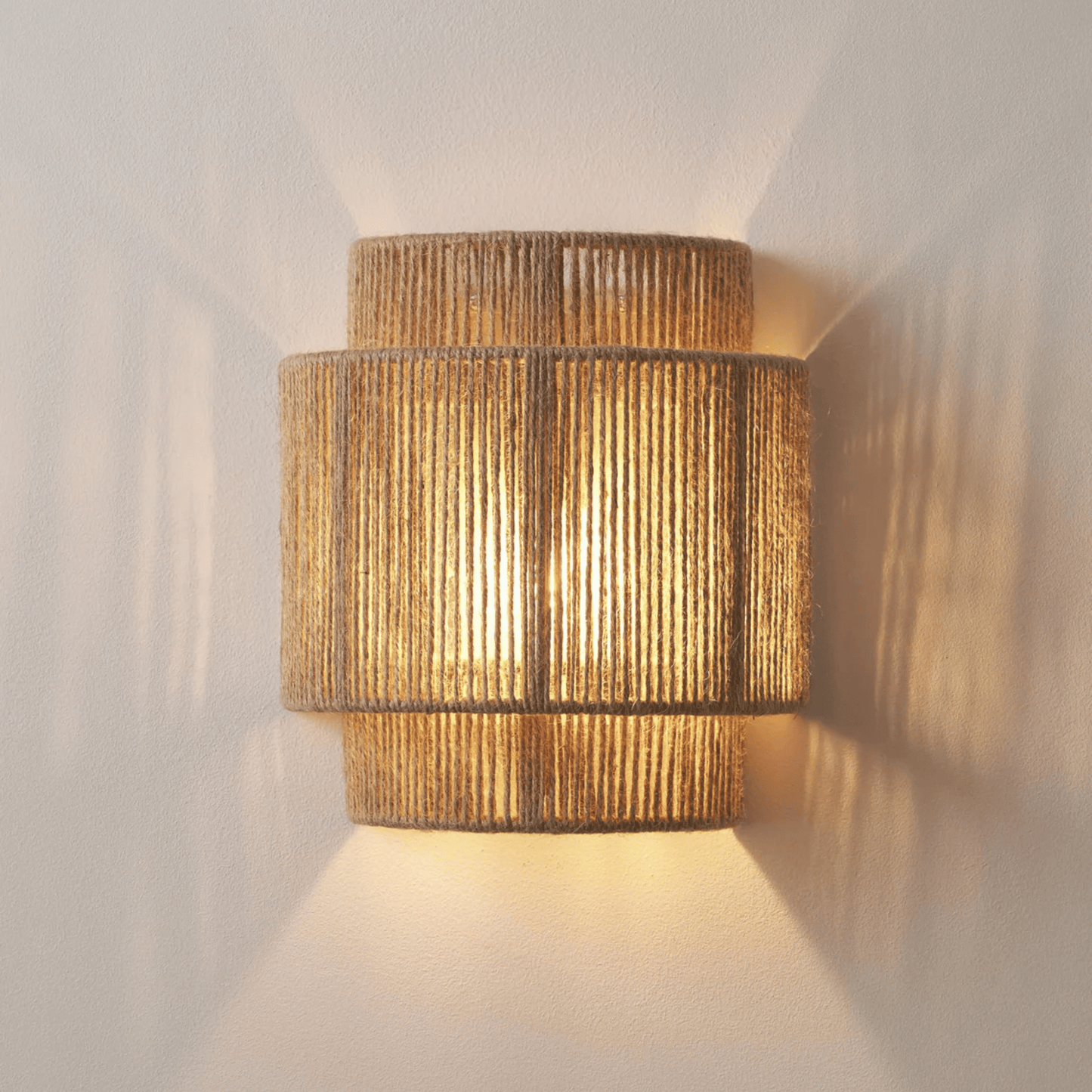 Woven wall light fixture on a plain wall