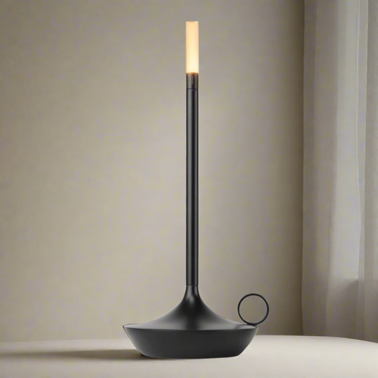 Black floor lamp with a white bulb on a white background