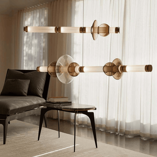 Modern living room with stylish pendant lights, sofa, and coffee table.