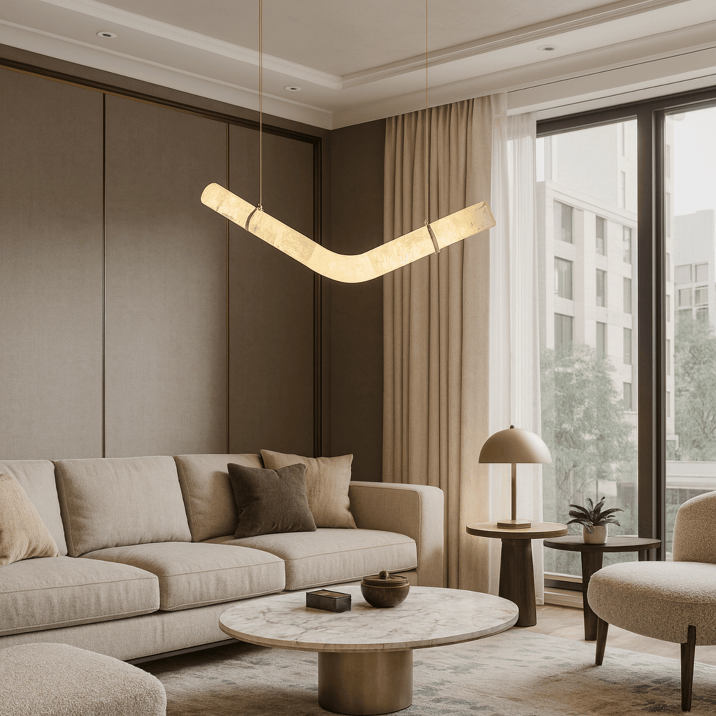 Modern living room with beige sofa, round coffee table, and pendant light.