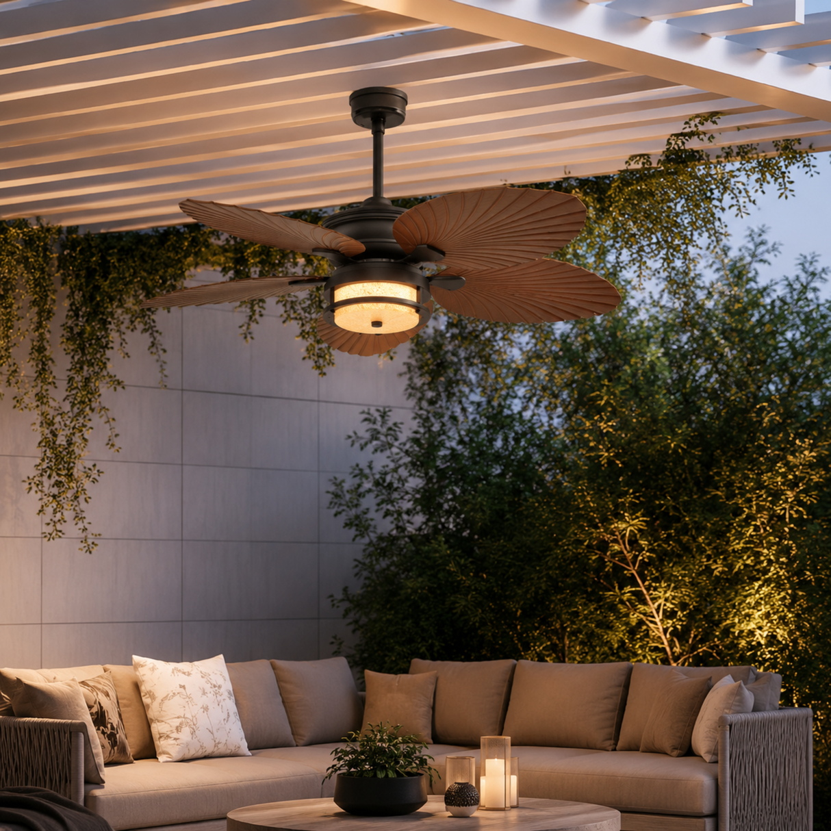 Ceiling fan above a patio with a couch and plants