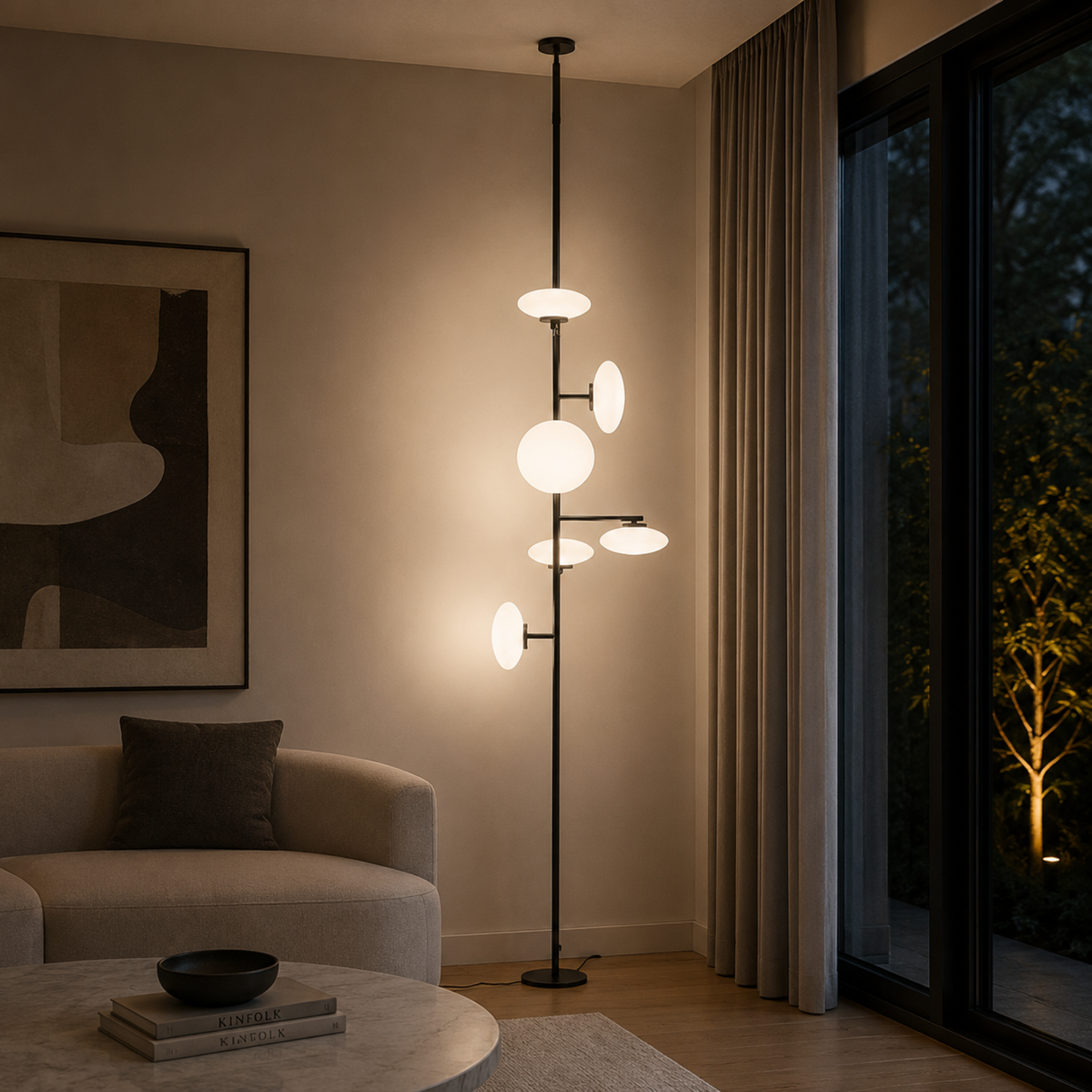 Modern floor lamp in a living room setting with a couch and abstract art.
