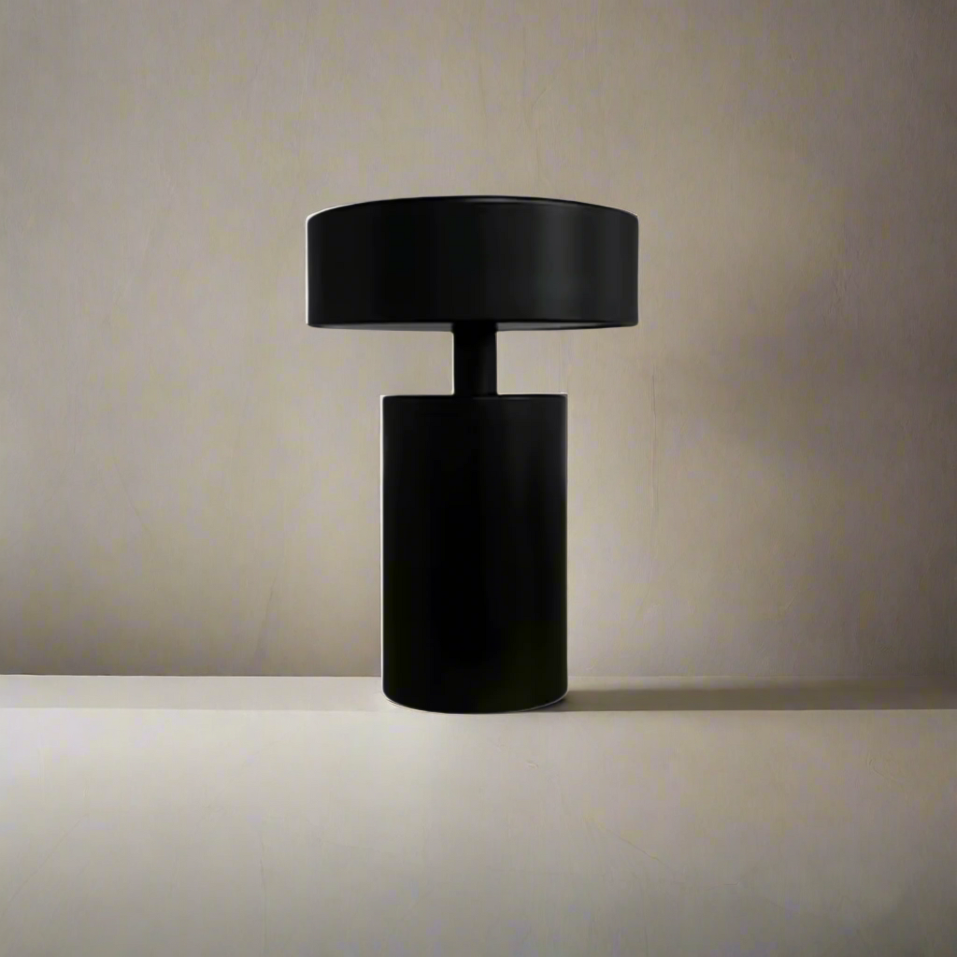 Black cylindrical lamp on a white background