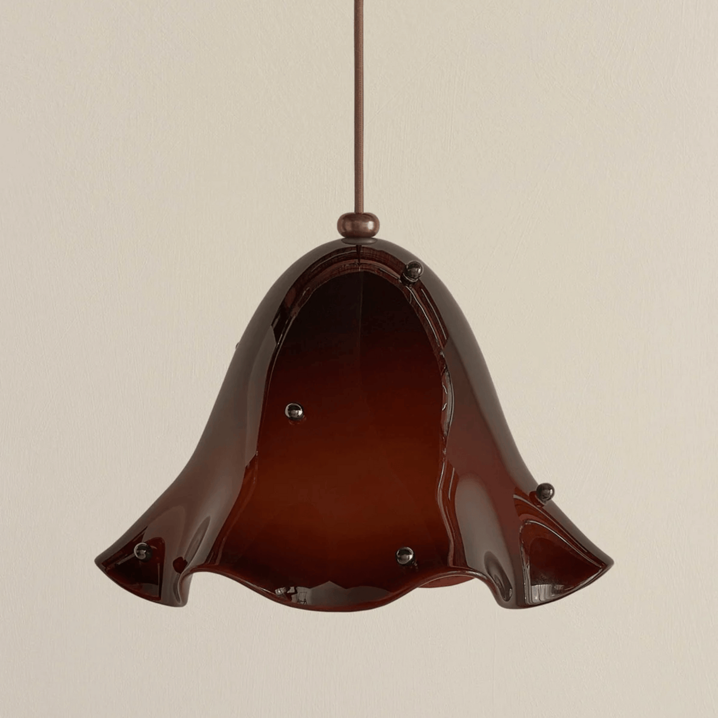 Brown pendant light with a beige background