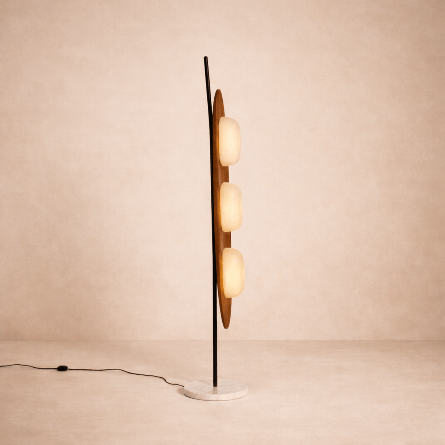 Modern floor lamp with multiple spherical lights on a beige background