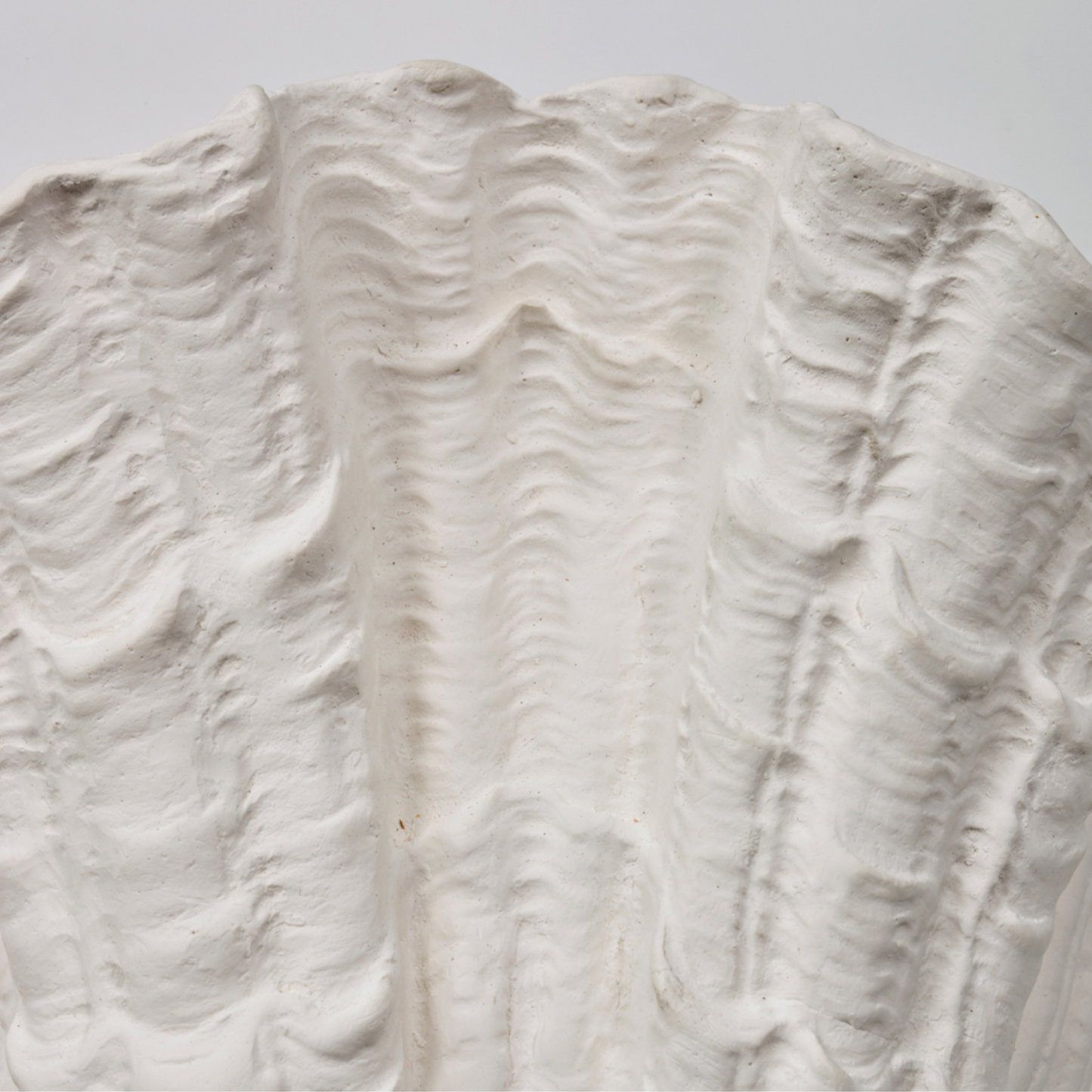 Close-up of a textured white surface with wavy patterns