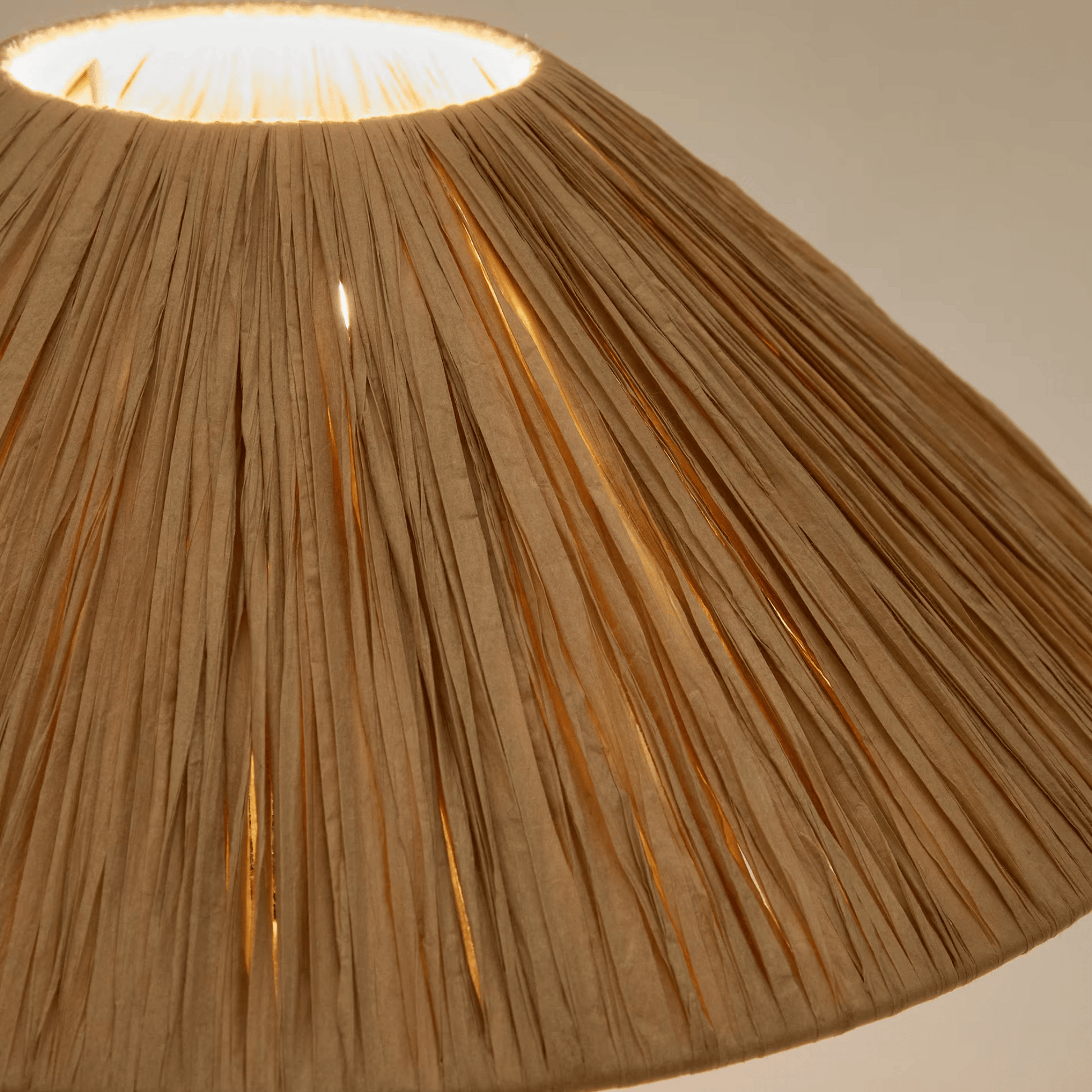 Close-up of a textured brown lampshade with a soft light background