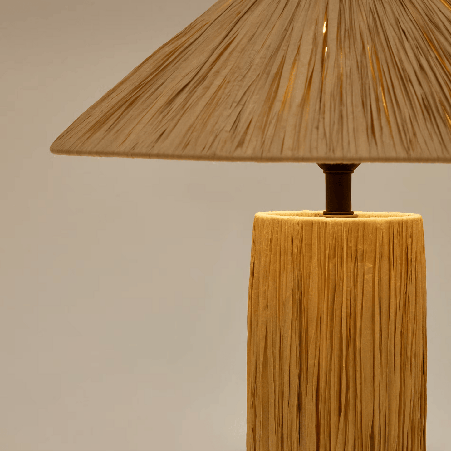 Wooden table lamp with a textured shade on a neutral background
