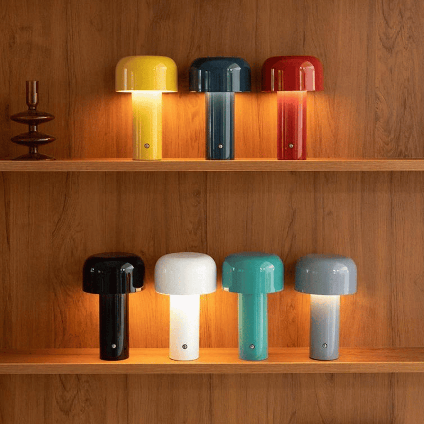 Colorful table lamps on wooden shelves