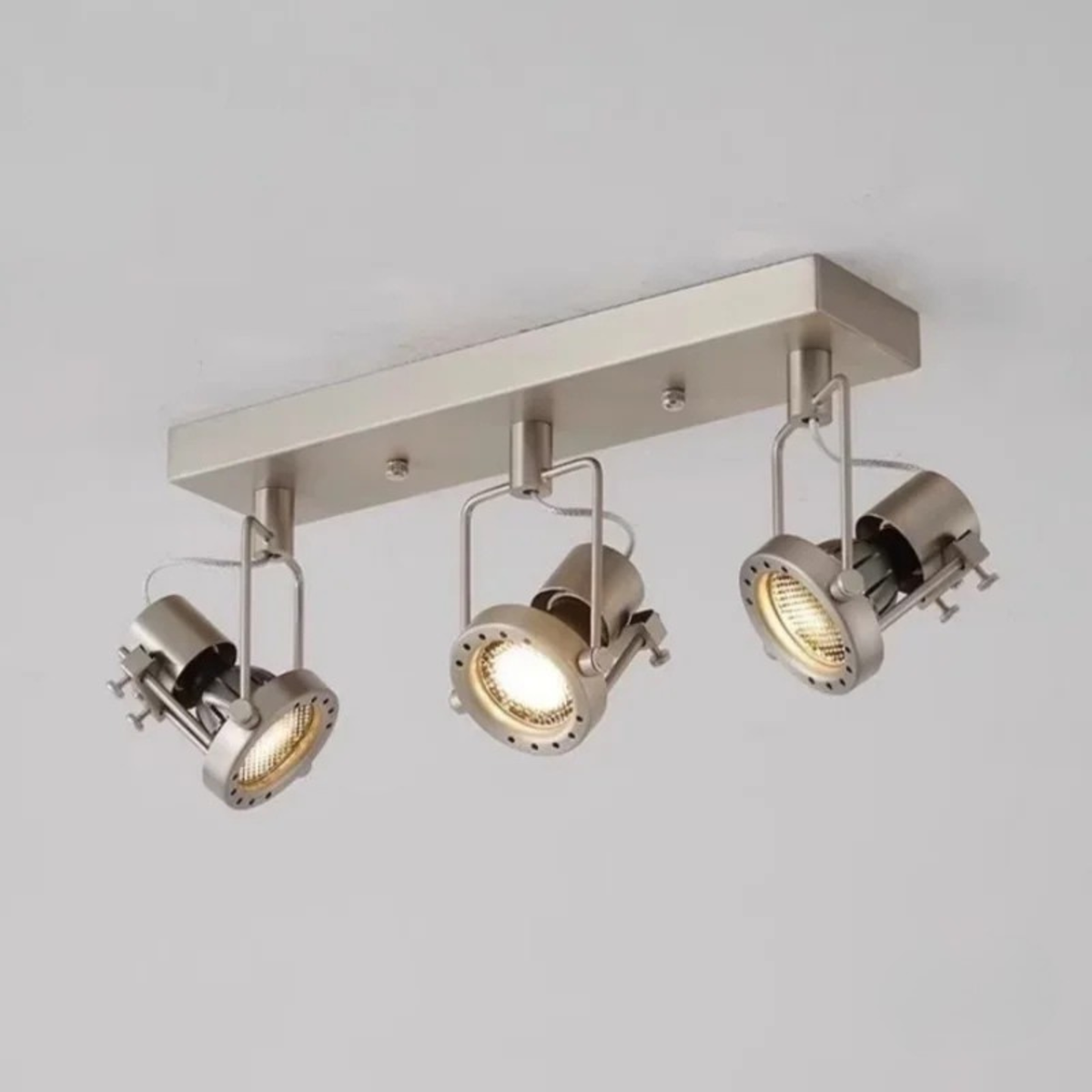 Another angle of the same dual spotlight fixture highlighting its metal texture.
