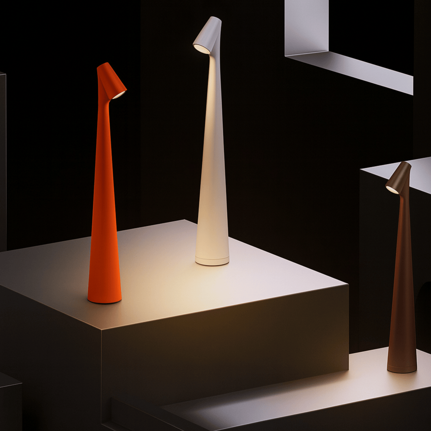 Three modern table lamps in orange, white, and brown on a black background