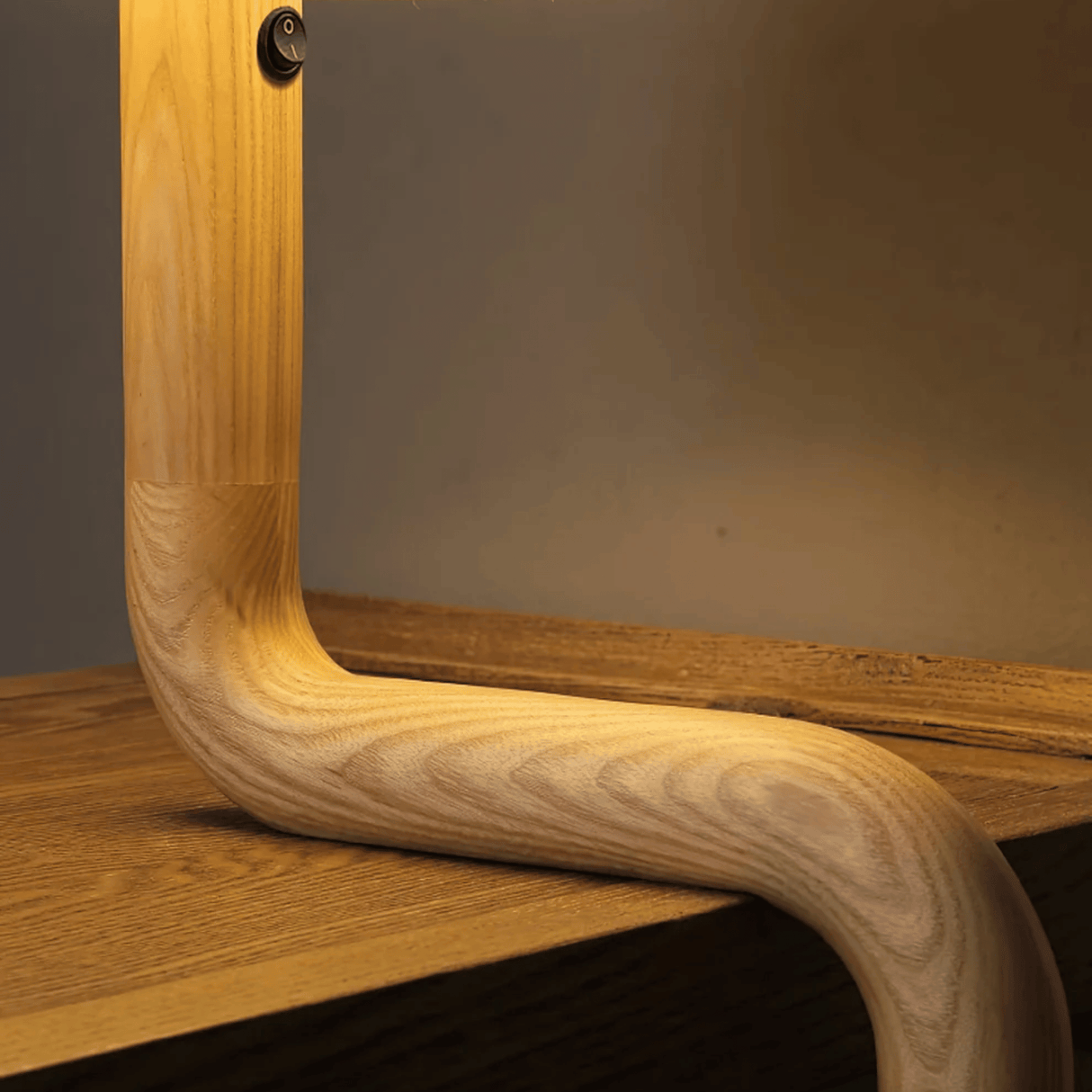 Wooden frame with a reflective surface on a wooden shelf