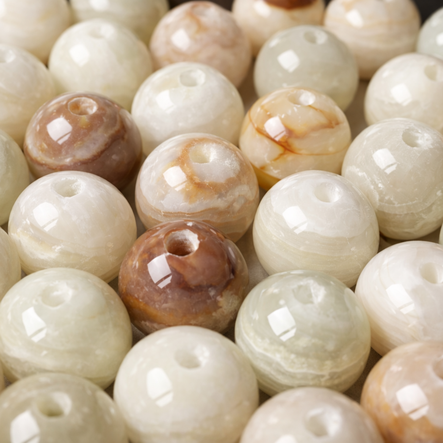 Close-up of round beige and brown beads.