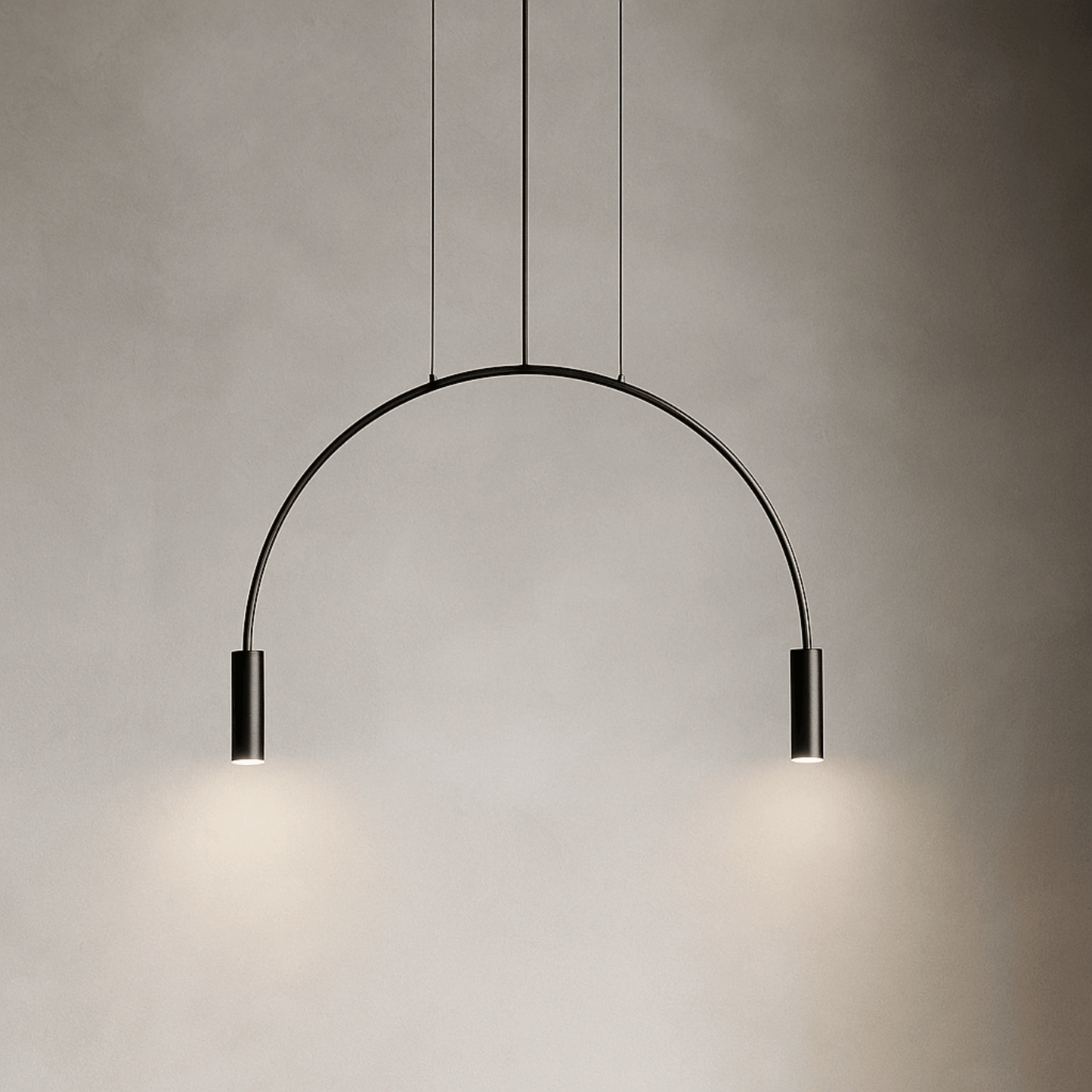 Modern pendant light with a curved design on a neutral background