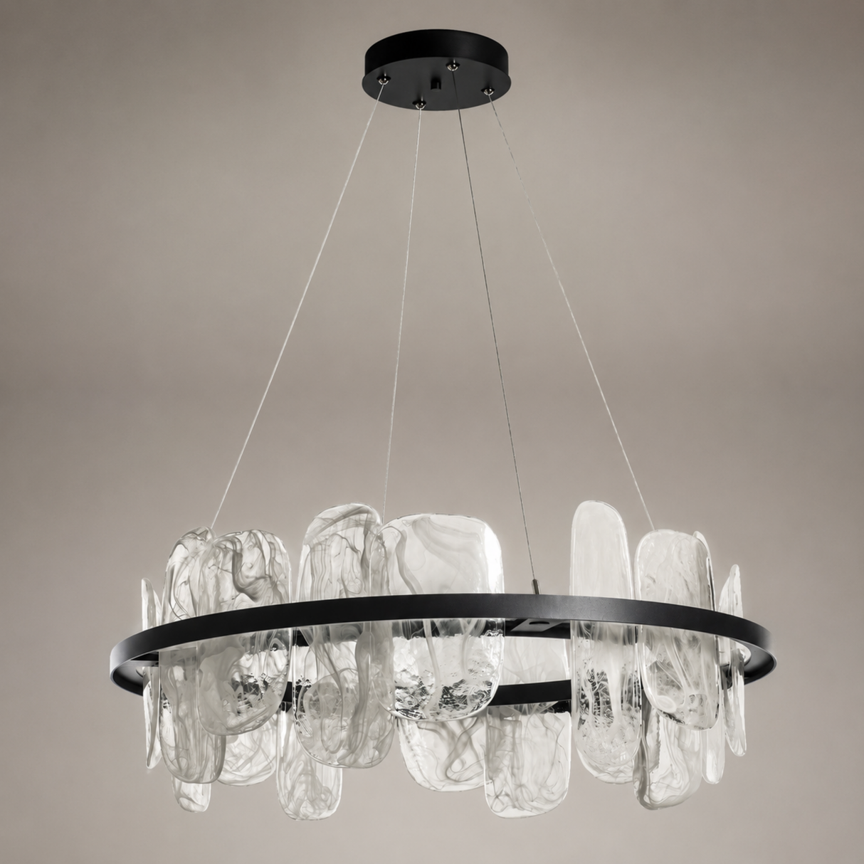 Modern chandelier with glass shades and black metal frame on a neutral background