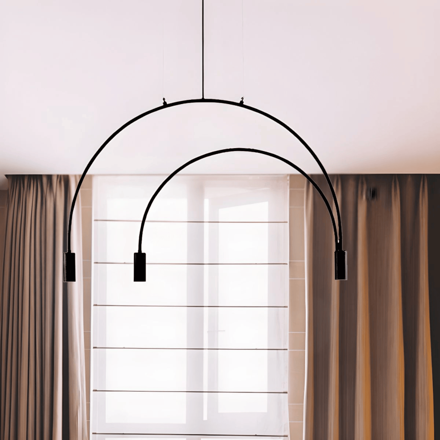 Modern black pendant light fixture hanging above a window with curtains.