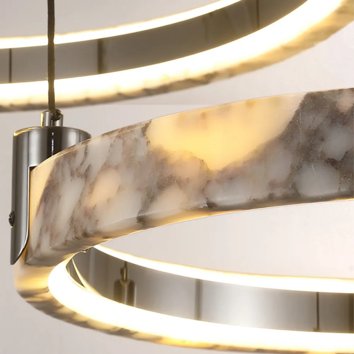 Modern wall light fixture with marble-like design on a neutral background