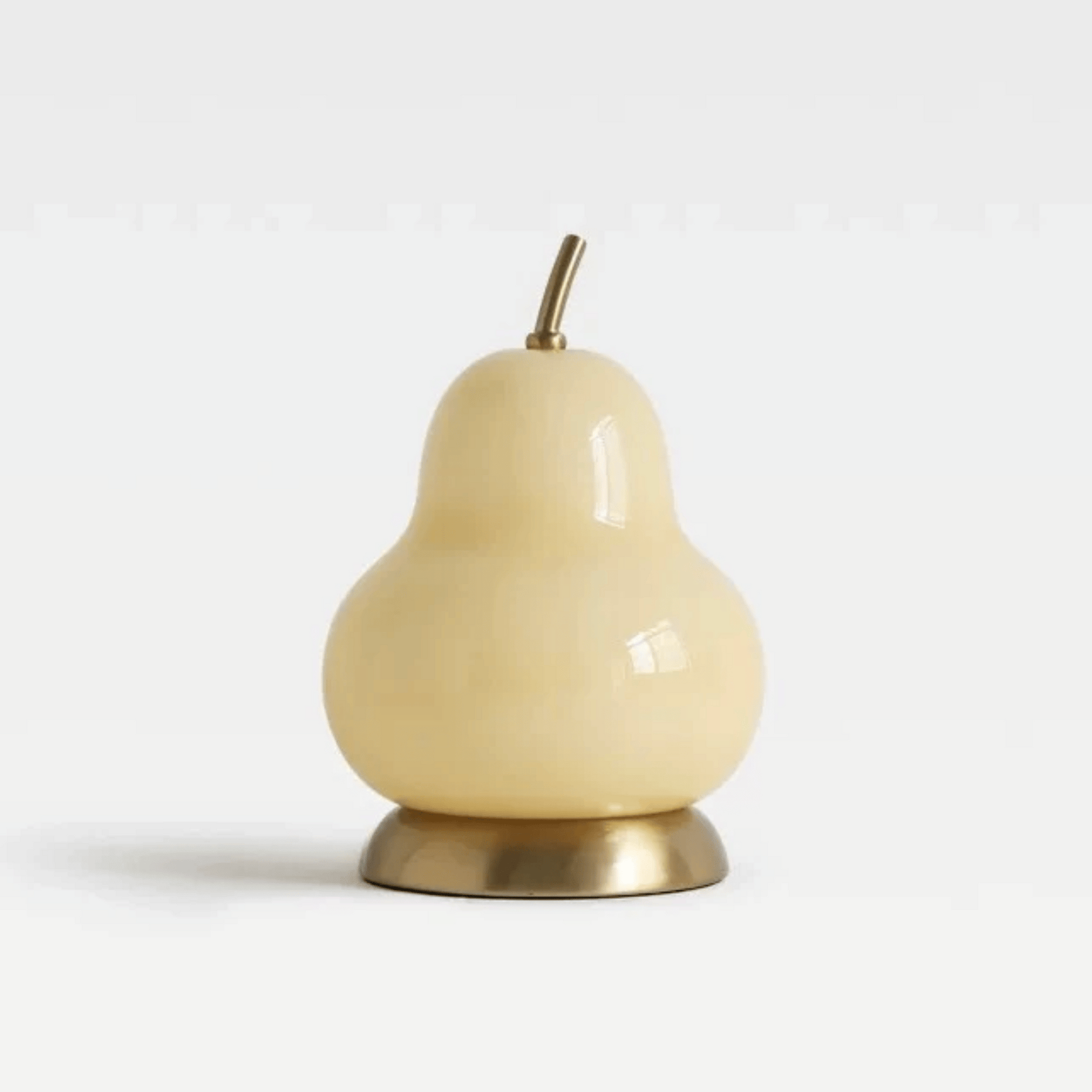 Decorative pear-shaped object with a gold base on a light gray background