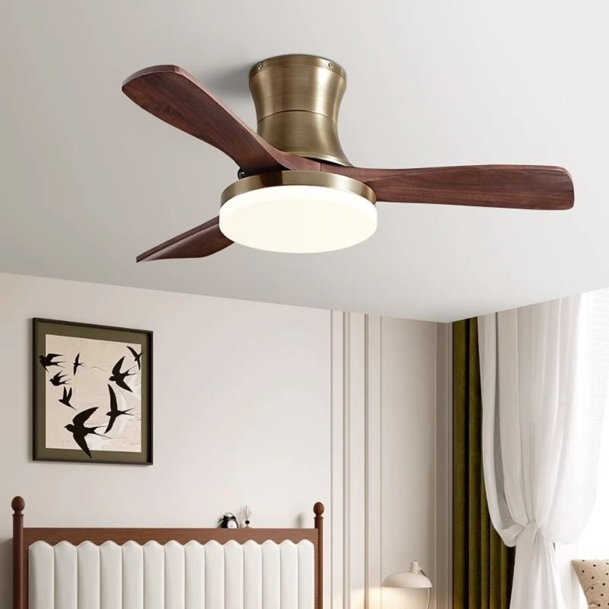 Ceiling fan with wooden blades and a light fixture in a room with a bed and wall art.