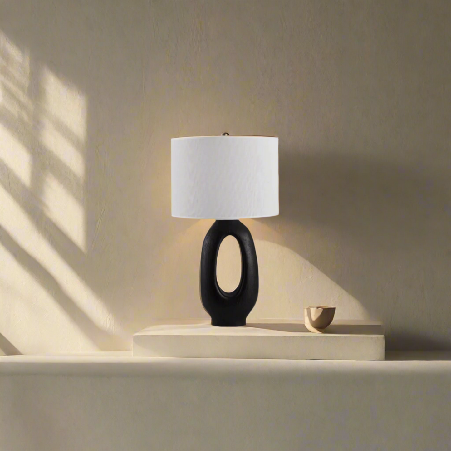 Modern Toki Glow Table Lamp combines artistic design with functionality, making it a perfect addition to your bedroom or living room. Black & White
