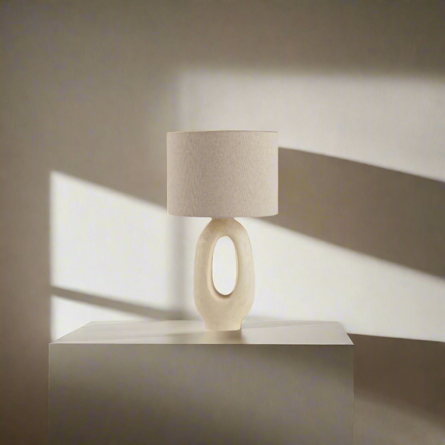 Modern Toki Glow Table Lamp combines artistic design with functionality, making it a perfect addition to your bedroom or living room. Beige & White