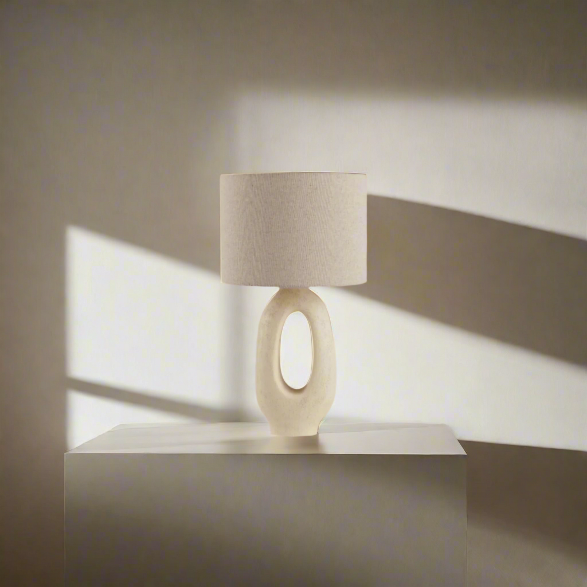 Modern Toki Glow Table Lamp combines artistic design with functionality, making it a perfect addition to your bedroom or living room. Beige & White