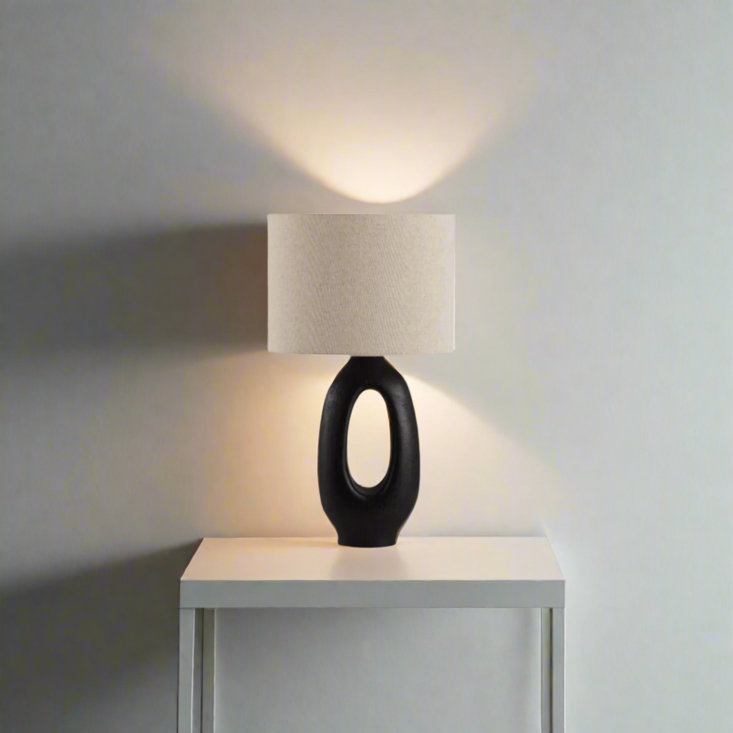 Modern Toki Glow Table Lamp combines artistic design with functionality, making it a perfect addition to your bedroom or living room. Black & Beige