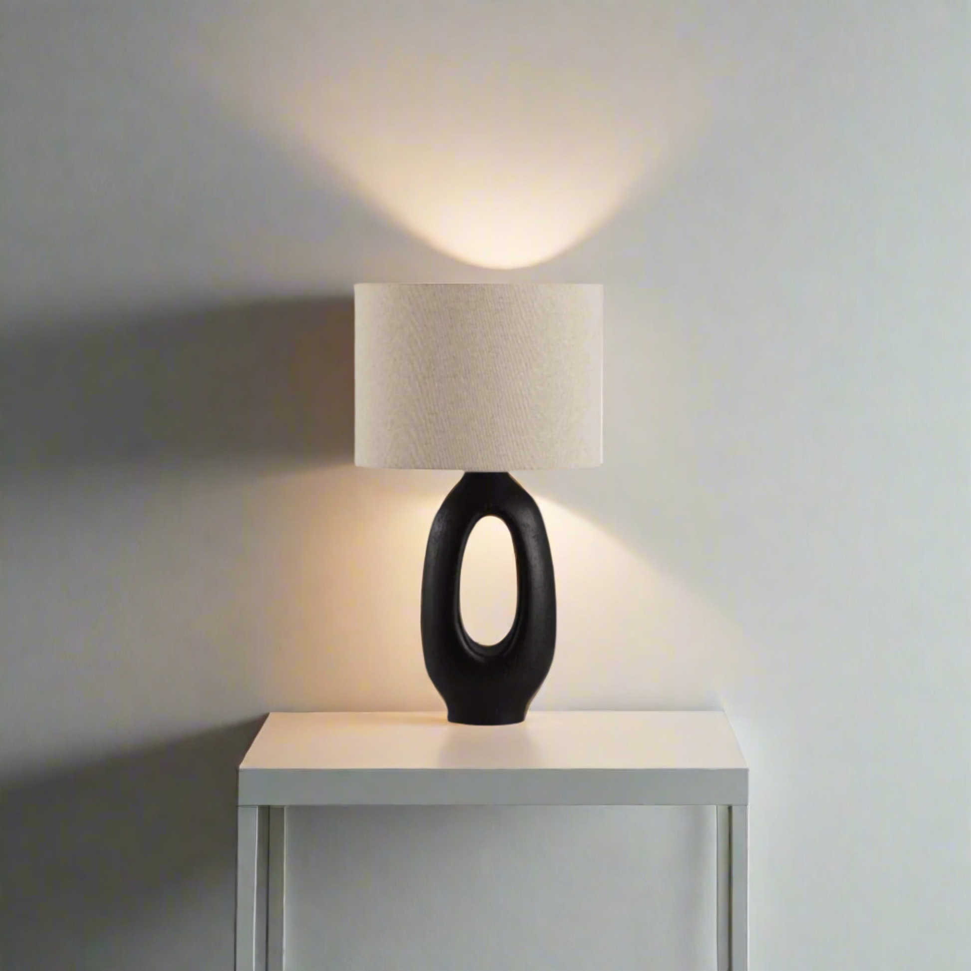 Modern Toki Glow Table Lamp combines artistic design with functionality, making it a perfect addition to your bedroom or living room. Black & Beige