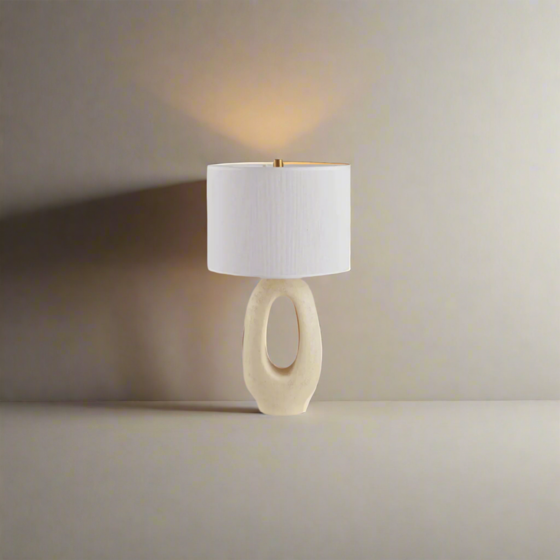 Modern Toki Glow Table Lamp combines artistic design with functionality, making it a perfect addition to your bedroom or living room.Beige & White