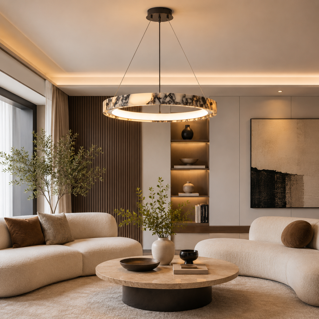 Modern living room with a chandelier, sofa, and decorative elements.