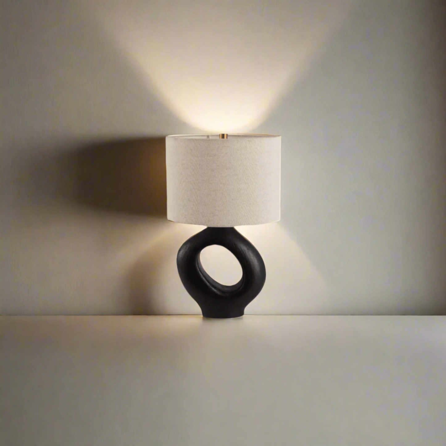 Modern Toki Glow Table Lamp combines artistic design with functionality, making it a perfect addition to your bedroom or living room. Black & Beige