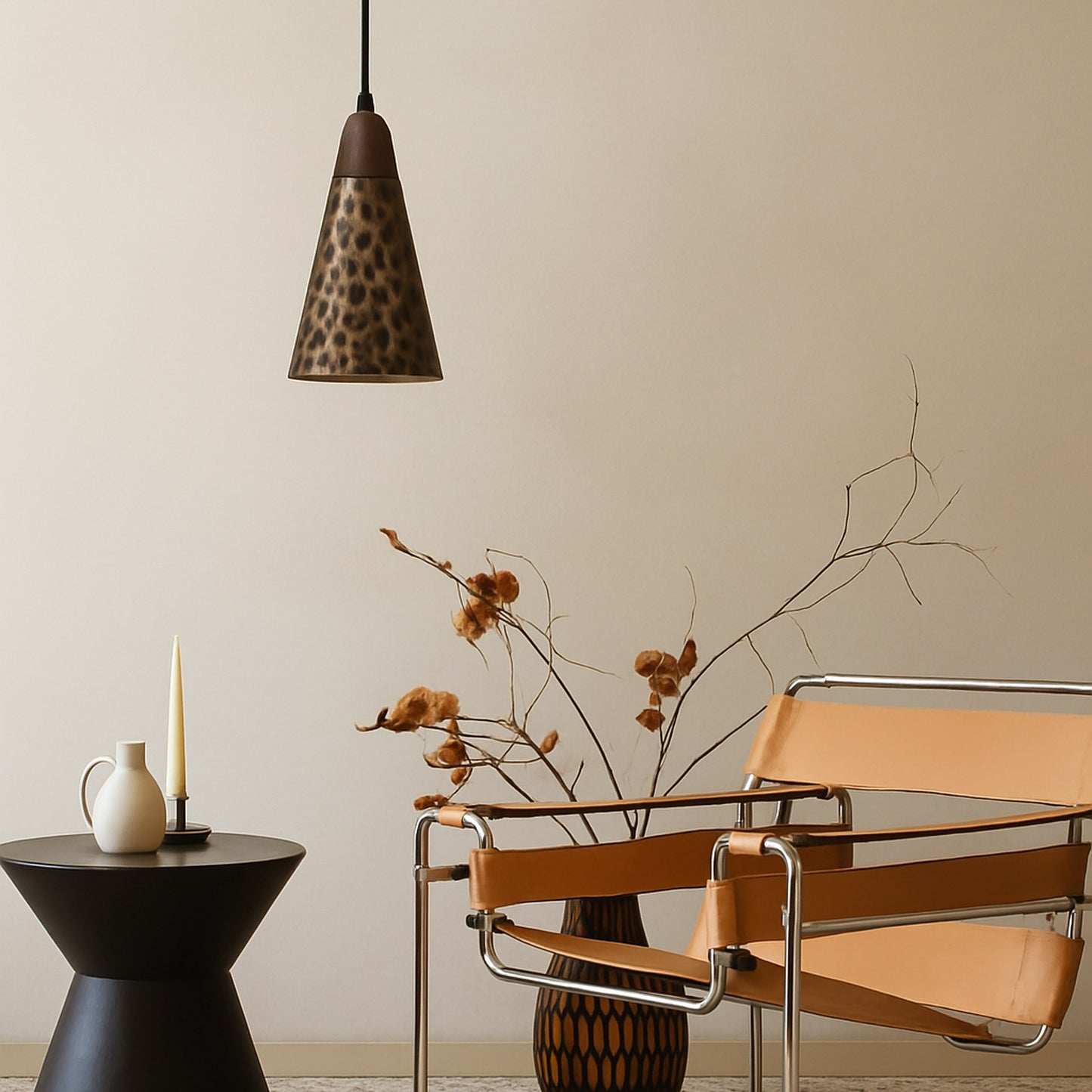 Modern interior with a brown chair, black table, and decorative lamp against a beige wall.