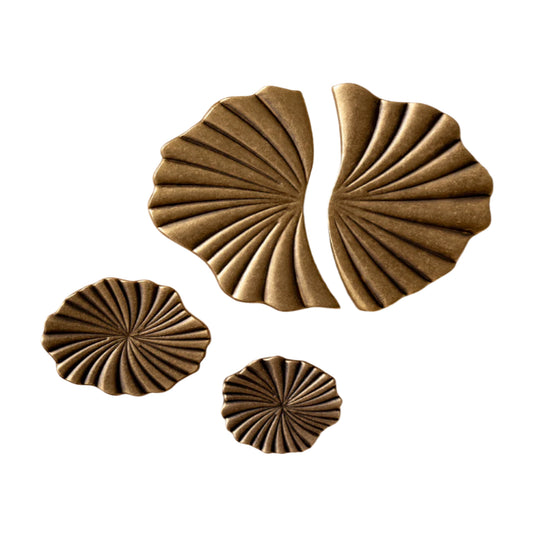 Decorative brass hardware on a white backround