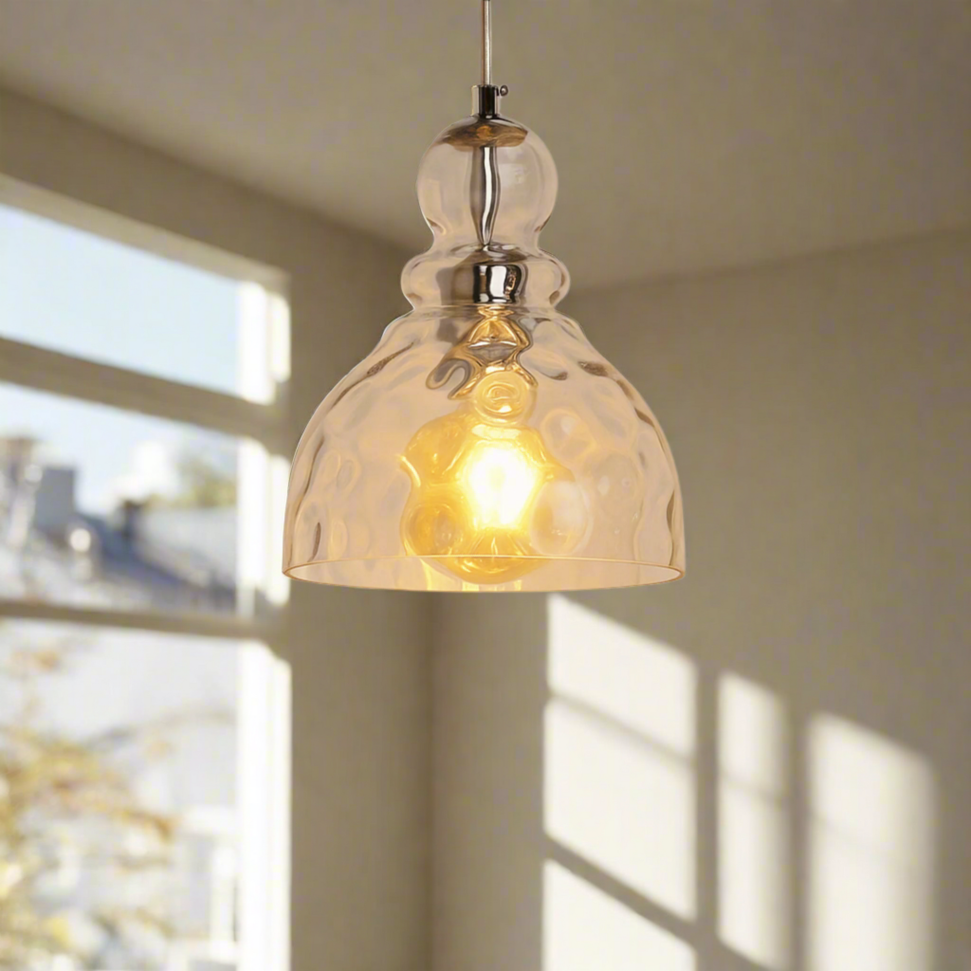 Amber glass pendant light on a white background
