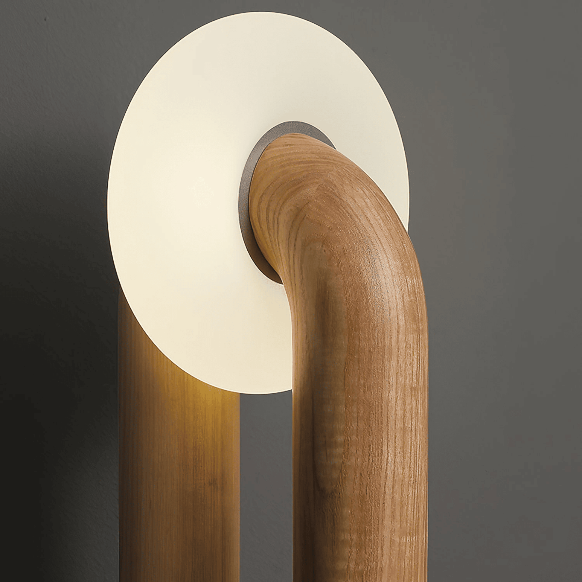 Wooden lamp with a round white shade on a dark background