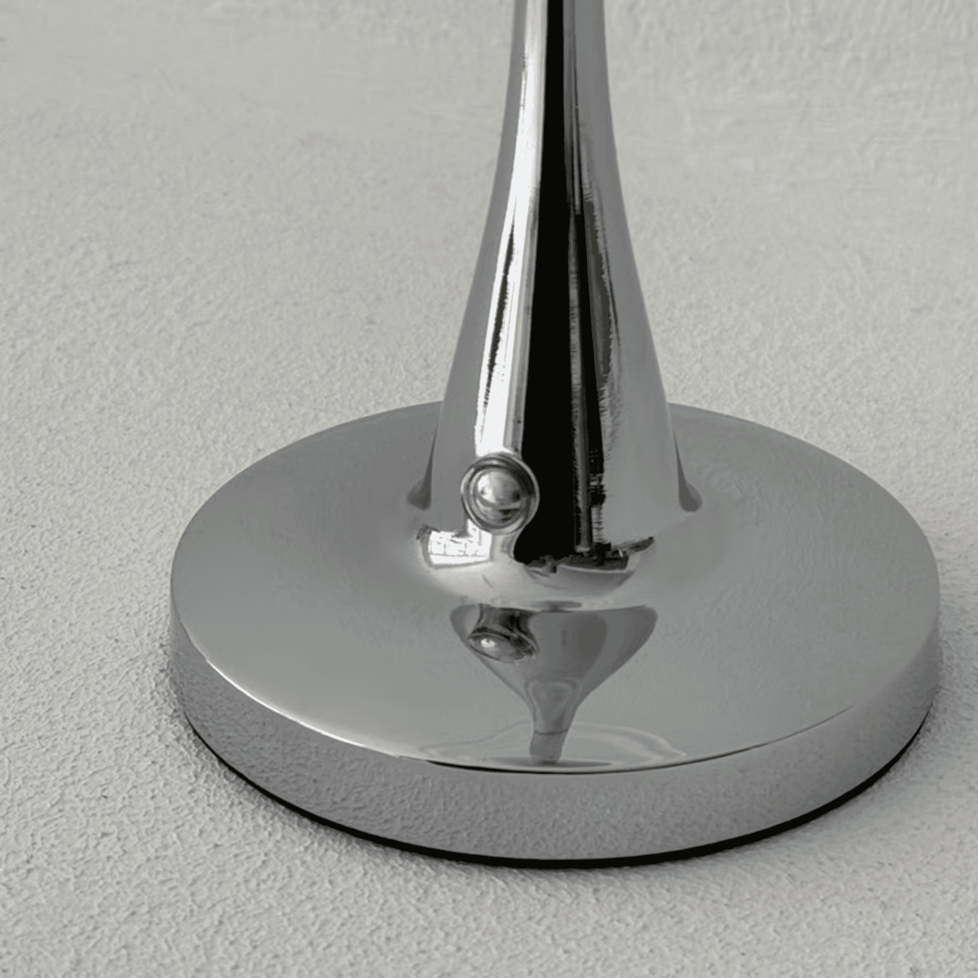 Chrome stand on a gray background