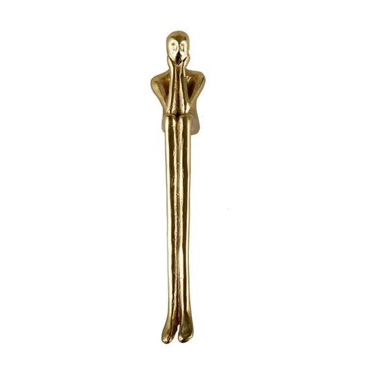 Gold Oscar statue on a white background
