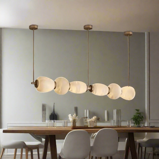 Modern pendant light with glass shades on a white background