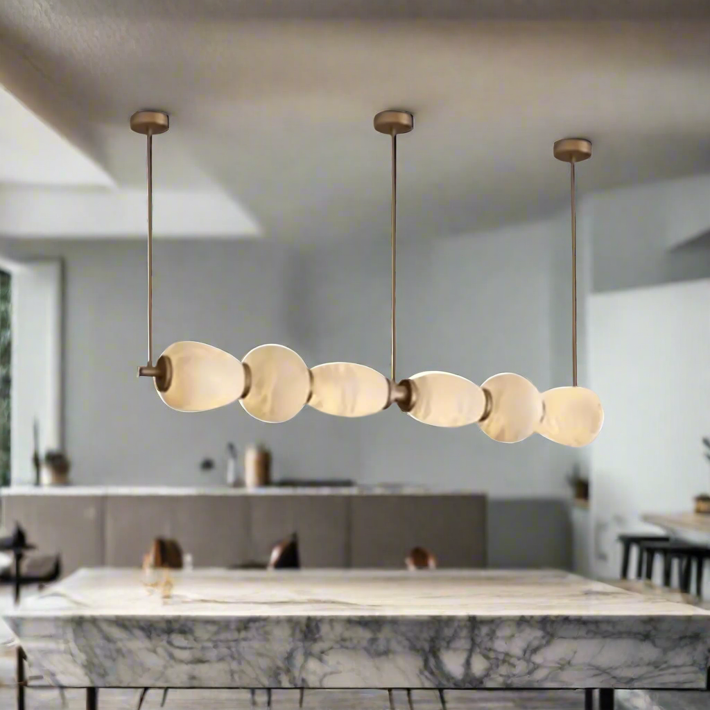 Modern pendant light fixture with glass shades on a beige background