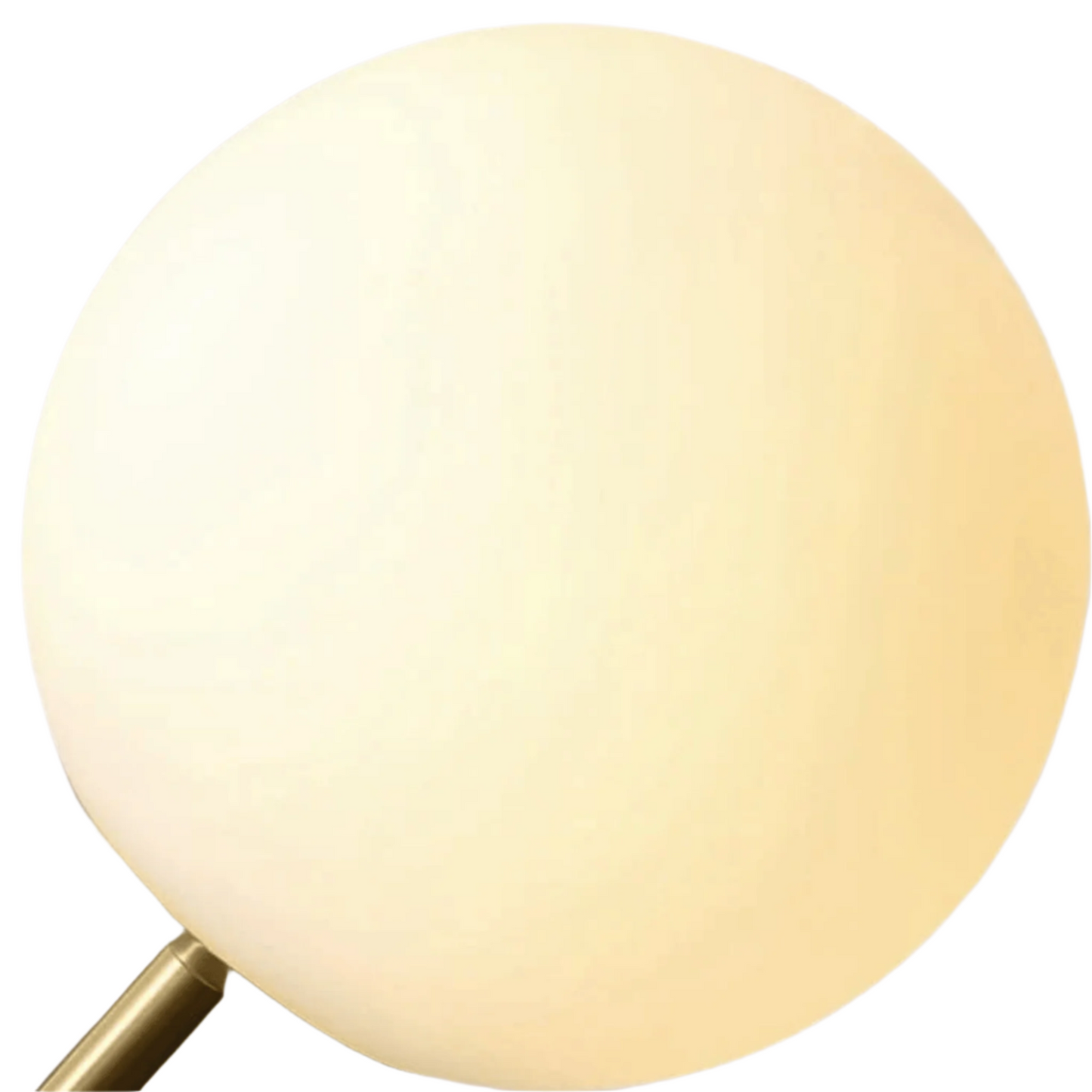 Round light fixture with a gold base on a beige background