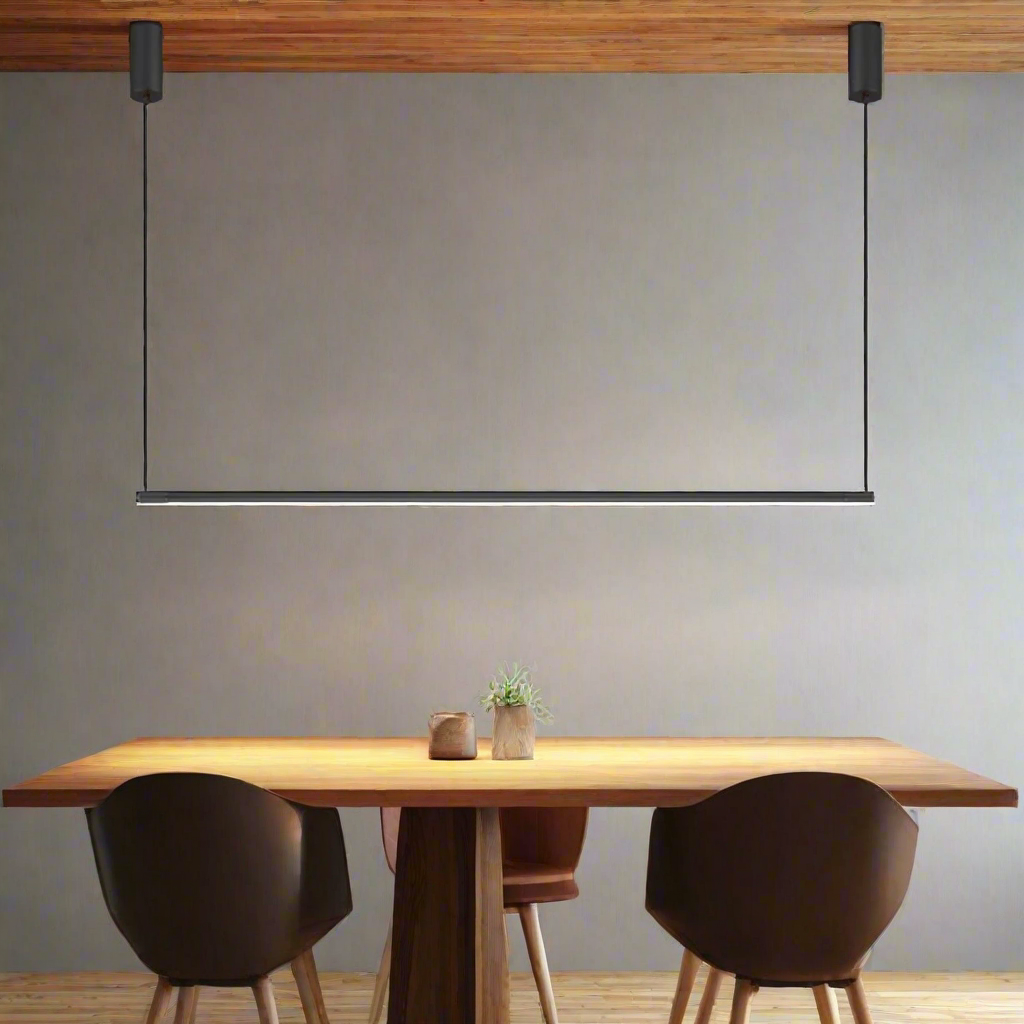 Modern dining area with a wooden table and chairs under a minimalist pendant light.