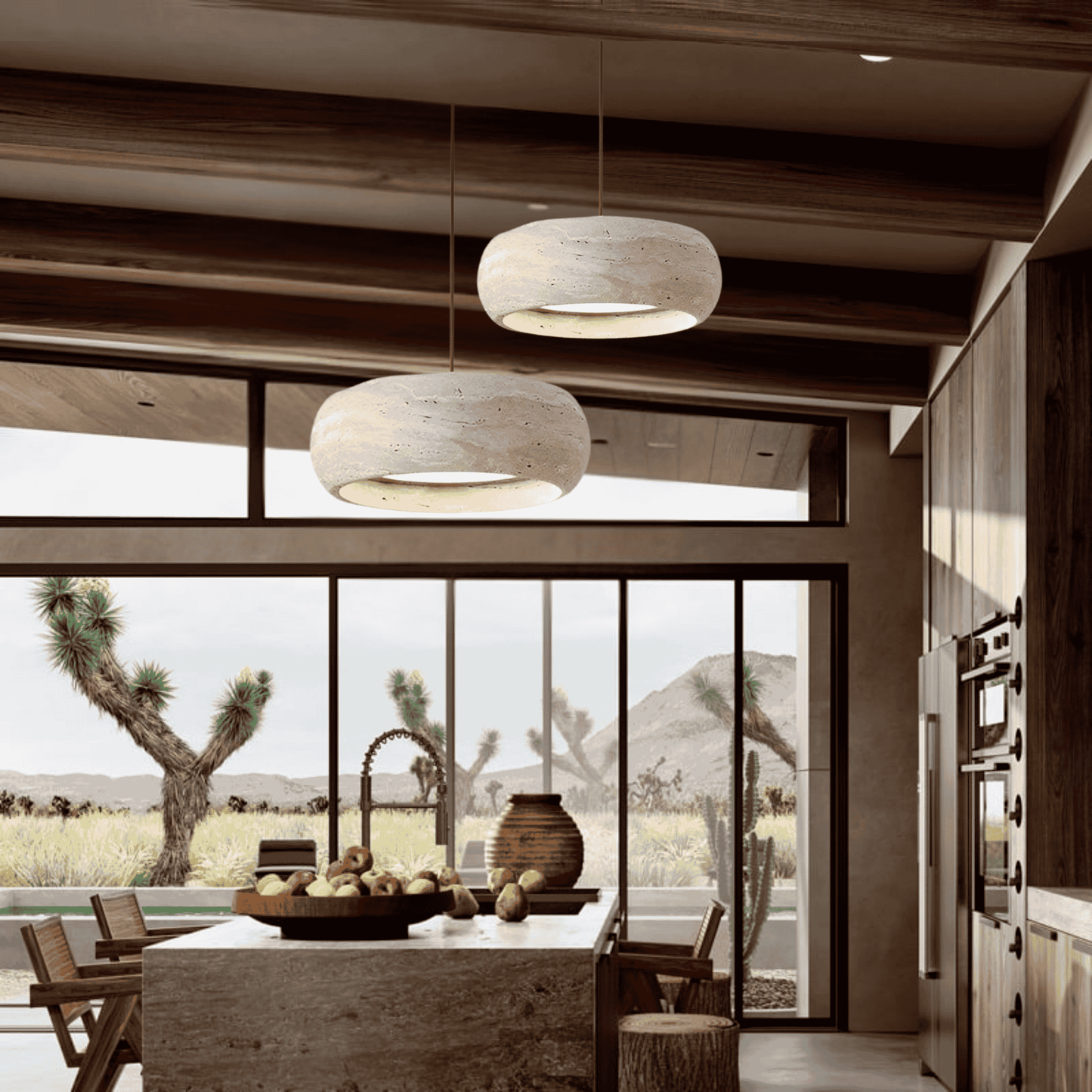 Pair of Ithaca Natural Stone LED Pendant Lights illuminating a rustic kitchen with desert views, blending modern and vintage aesthetics.