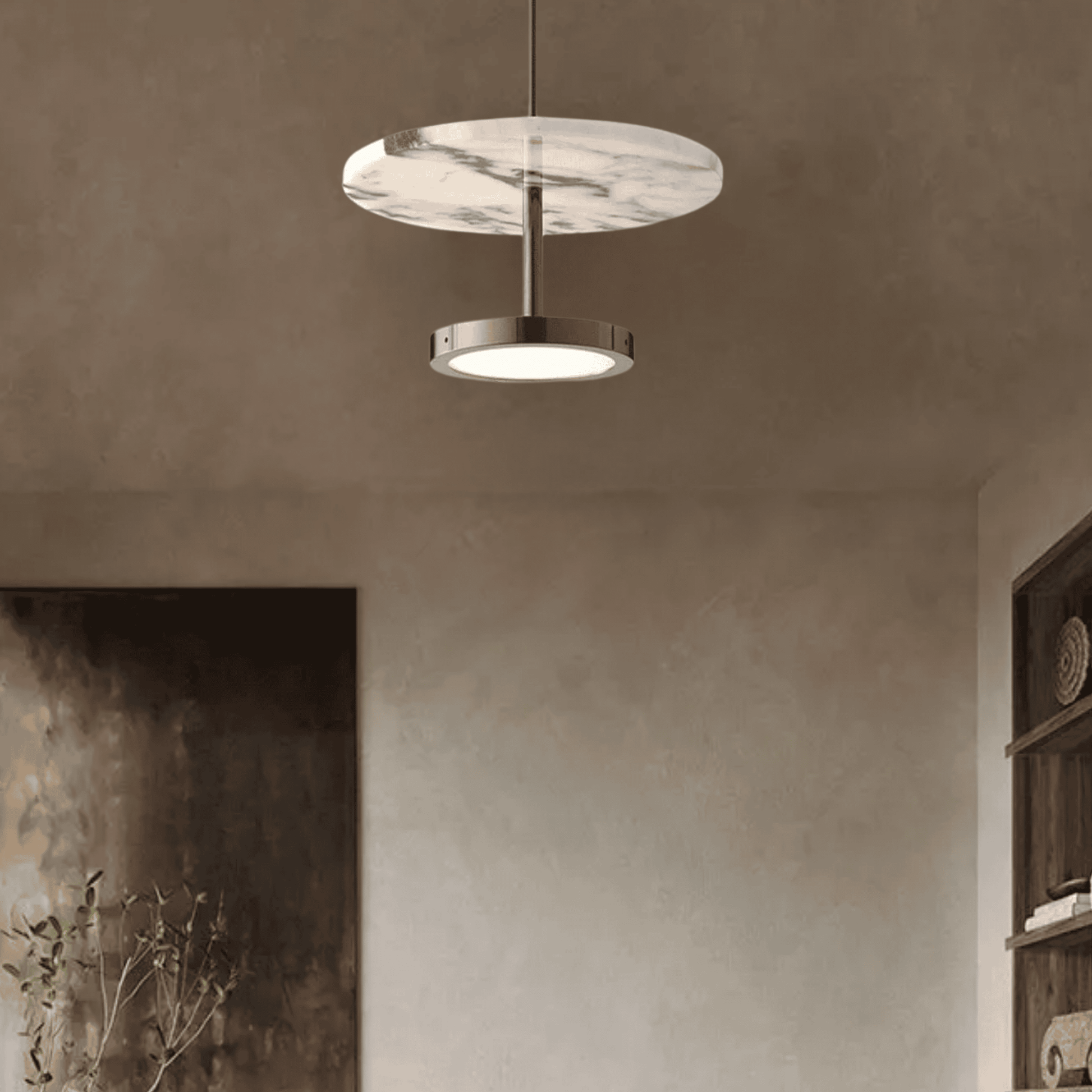 Modern marble disc pendant light with brushed metal fixture in living room