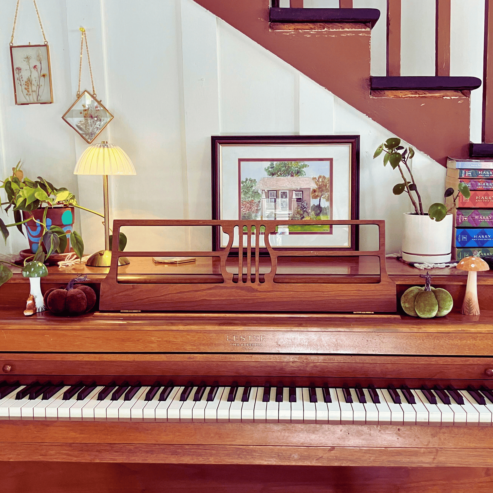 Wooden piano with decorative items on a staircase