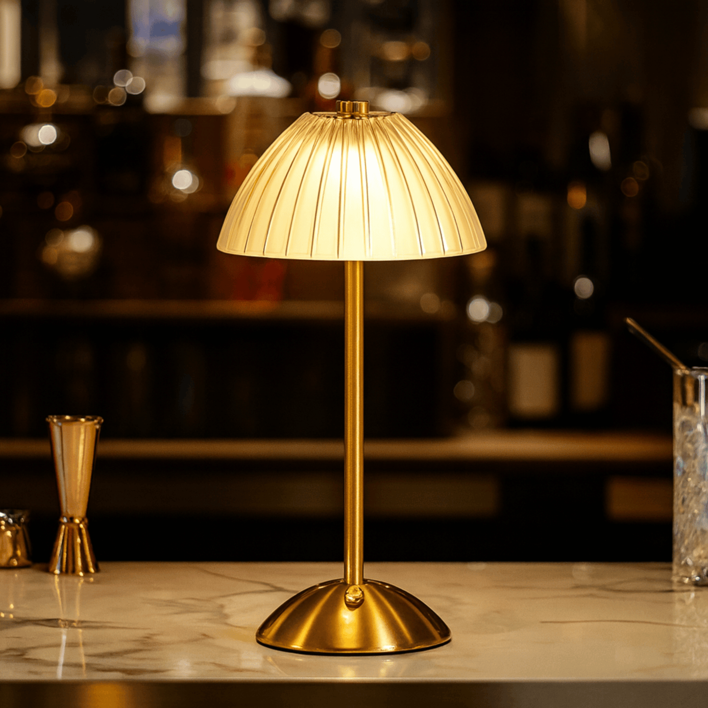 Gold table lamp on a bar counter with blurred bar background