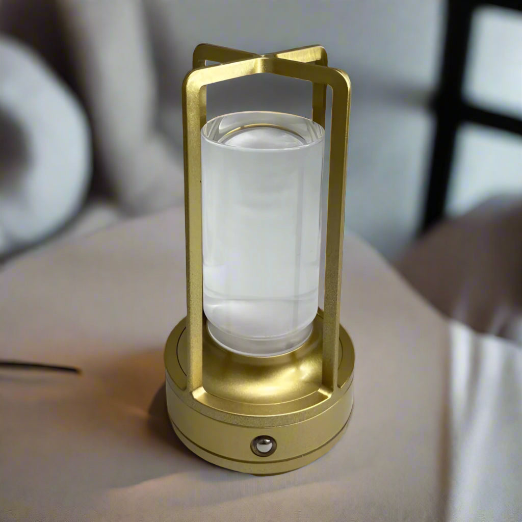 Gold lantern with a clear glass cover on a white background