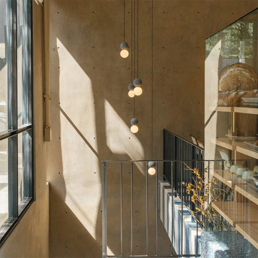 Stylish Minimalist Terrazzo Pendant Light enhances Nordic staircase, perfect for bars, restaurants, and bedrooms.