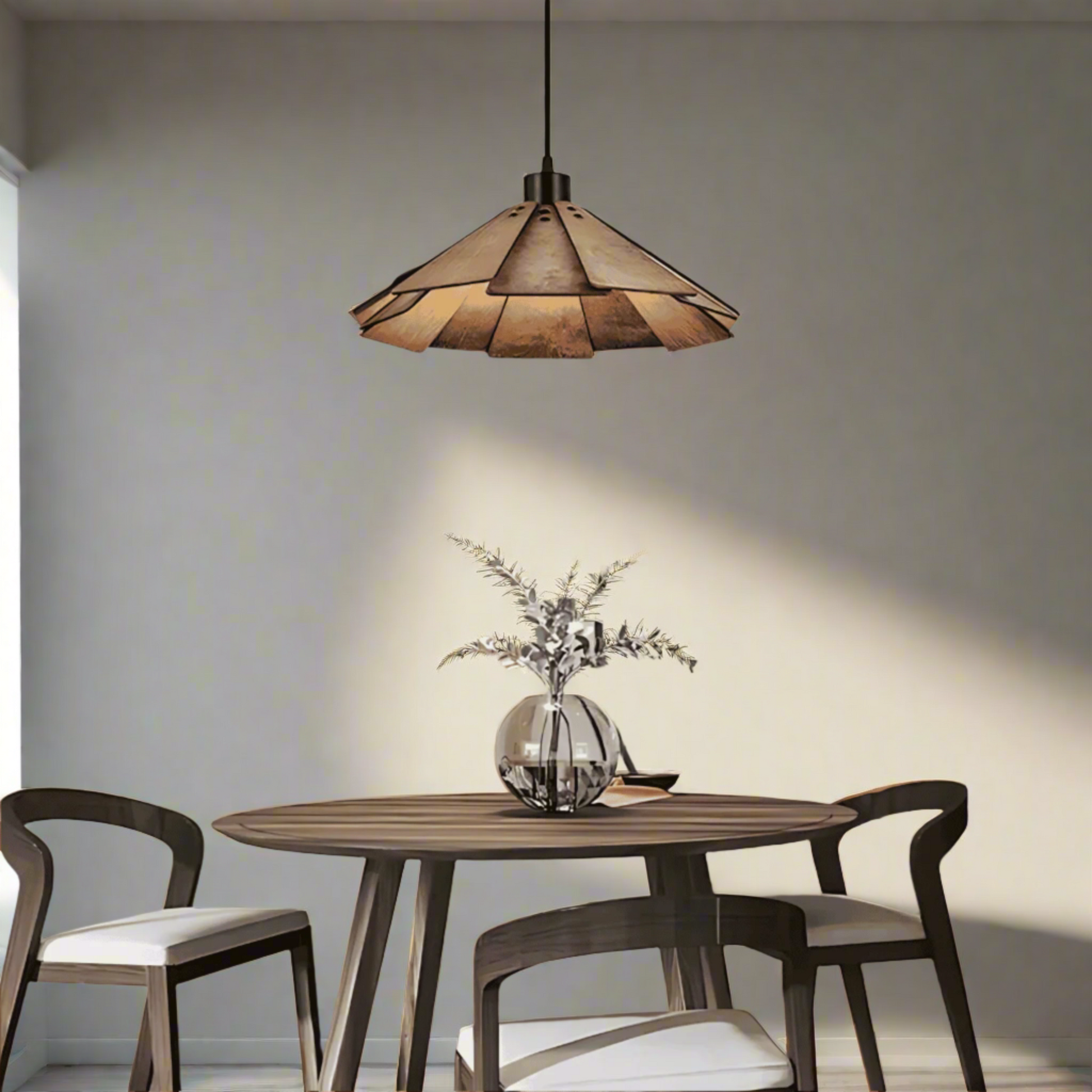 Dining room with wooden table and chairs, pendant light, and decorative elements.